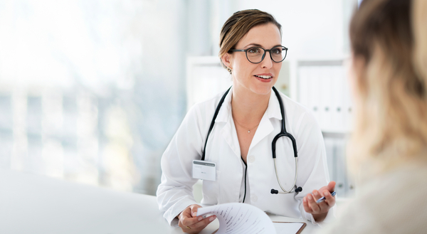 Cropped shot of an attractive young female doctor consulting with a patient inside her office at a hospital